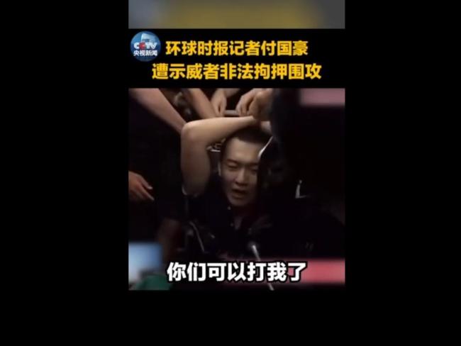 Screenshot of Fu Guohao being tied up by Hong Kong demonstrators at Hong Kong airport. [Photo: China Plus]