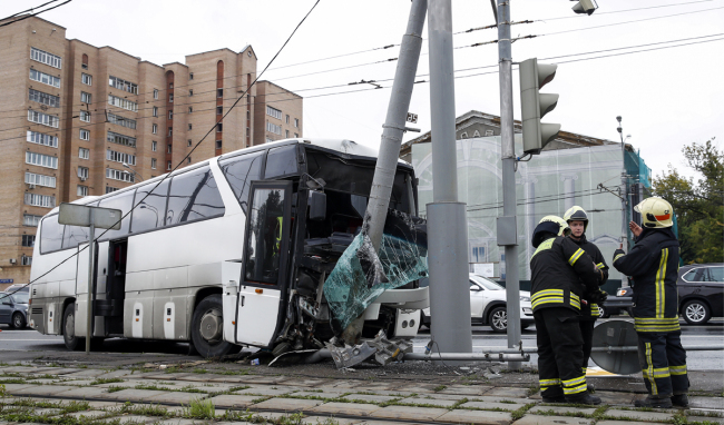 A charter bus carrying over 30 Chinese tourists crashes into a utility pole in eastern Moscow, Russia. [Photo: TASS via IC/Artyom Geodakyan]