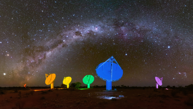 A handout made available by the CSIRO shows the milky way in the night sky above six of the Australian Square Kilometre Array Pathfinder's (ASKAP) antennas, which are illuminated with colours of rainbow in remote Western Australia, Australia, February 12, 2019. [File Photo: EPA via IC/ALEX CHERNEY]