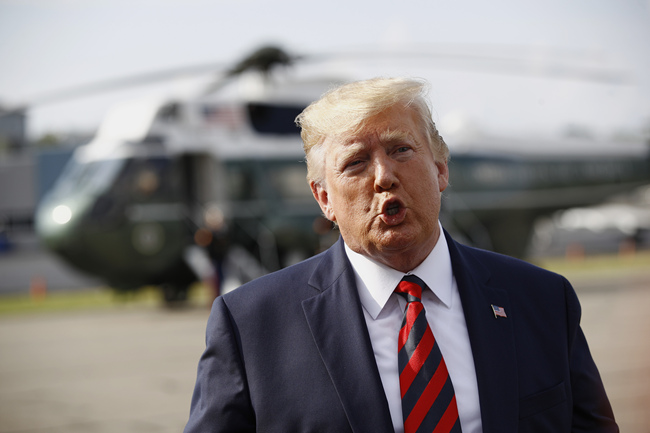 U.S. President Donald Trump speaks with reporters before boarding Air Force One at Morristown Municipal Airport in Morristown, N.J., Sunday, Aug. 18, 2019. [Photo: AP via IC/Patrick Semansky]