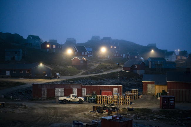 Early morning fog shrouds homes in Kulusuk, Greenland on Aug.15, 2019. [Photo: AP Photo/Felipe Dana]