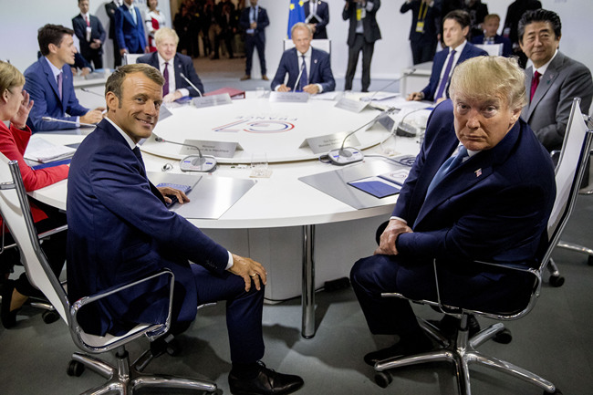 French President Emmanuel Macron, center left, and President Donald Trump, center right, participate in a G-7 Working Session on the Global Economy, Foreign Policy, and Security Affairs the G-7 summit in Biarritz, France, Sunday, Aug. 25, 2019. [Photo: AP/Andrew Harnik, Pool]