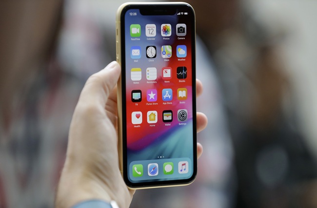 This Sept. 12, 2018, file photo shows an Apple iPhone XR on display at the Steve Jobs Theater after an event to announce new products, in Cupertino, Calif. [Photo: AP]