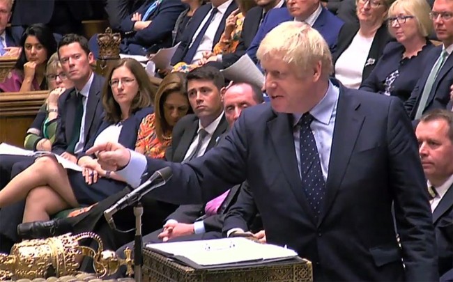 A video grab from footage broadcast by the UK Parliament's Parliamentary Recording Unit shows Britain's Prime Minister Boris Johnson gestures toward the opposition benches as he stands at the dispatch box and speaks in the House of Commons in London on September 3, 2019. [Photo: AFP]