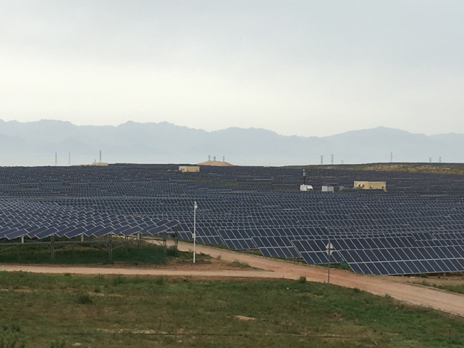 The solar farm in Kubuqi desert has 650,000 fixed and sun-tracking panels.[Photo: from China Plus]