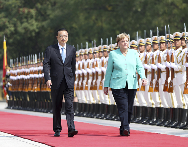 Premier Li Keqiang holds a welcome ceremony at the east plaza of the Great Hall of the People for German Chancellor Angela Merkel, who is on her 12th official visit to China, on Friday, Sept 6, 2019. [Photo: gov.cn]