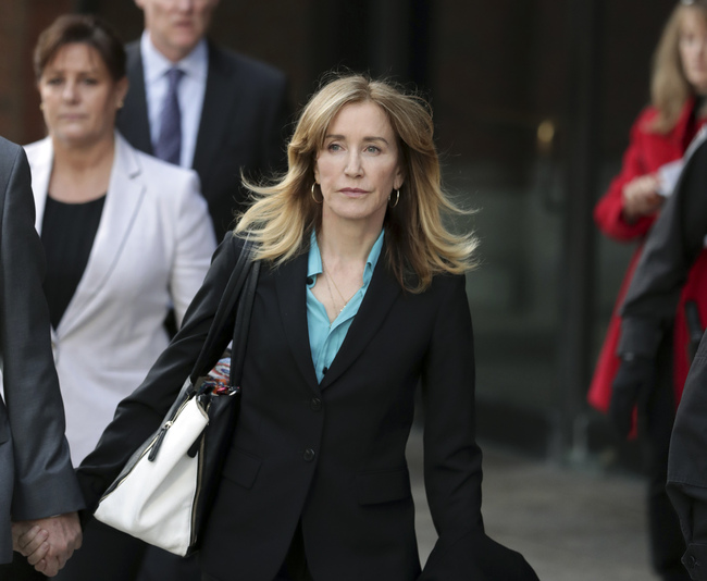 This April 3, 2019 file photo shows actress Felicity Huffman departing federal court in Boston after facing charges in a nationwide college admissions bribery scandal. Federal prosecutors are asking a judge to sentence “Desperate Housewives” star Felicity Huffman to a month in jail for her role in the sweeping college admissions bribery scandal. [Photo: AP]