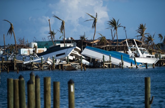 Destroyed boats are pushed up against the pier in the aftermath of Hurricane Dorian in Treasure Cay on Abaco island, Bahamas, on September 11, 2019. [Photo: AFP]
