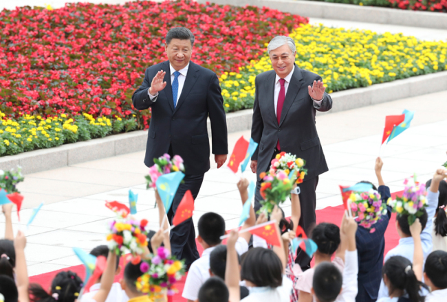 Chinese President Xi Jinping hosts a welcome ceremony for his Kazakh counterpart Kassym-Jomart Tokayev outside the Great Hall of the People in Beijing on September 11, 2019. [Photo: Xinhua]