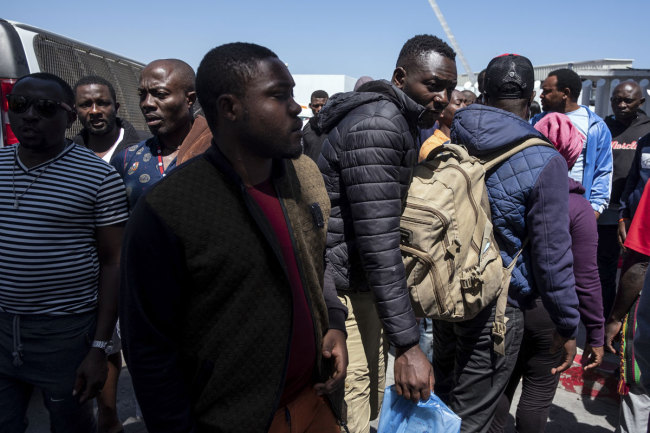 A group of asylum seekers, mostly from African countries, leave El Chaparral port of entry after a protest in Tijuana, Baja California state on July 9, 2019, northwestern Mexico. [Photo: AFP]