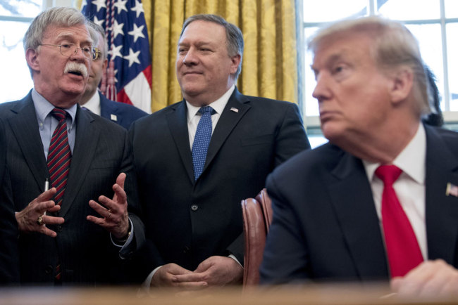 From left, U.S. National Security Adviser John Bolton, accompanied by Secretary of State Mike Pompeo, and President Donald Trump, speaks before Trump signs a National Security Presidential Memorandum to launch the "Women's Global Development and Prosperity" Initiative in the Oval Office of the White House in Washington, Thursday, Feb. 7, 2019. [File photo: AP/IC]