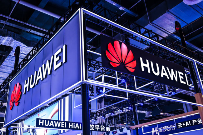 Huawei logos are seen at the 2019 World Artificial Intelligence Conference in Shanghai [File photo: IC]