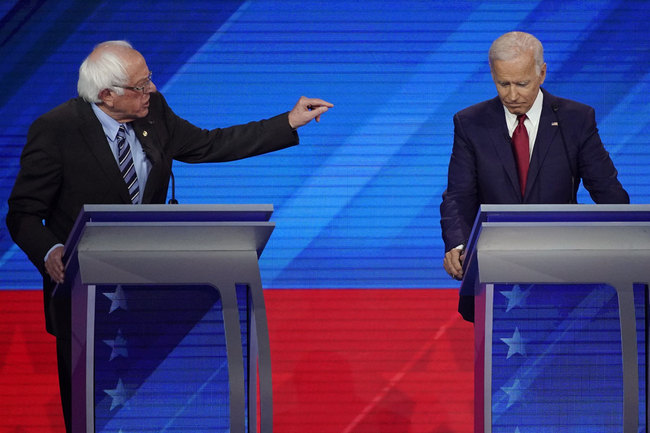 Sen. Bernie Sanders, I-Vt., left, speaks as former Vice President Joe Biden, right, listens Thursday, Sept. 12, 2019, during a Democratic presidential primary debate hosted by ABC at Texas Southern University in Houston. [Photo: AP]