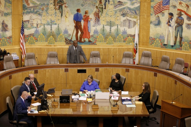 Senate President, state Senator Steven Bradford, D-Gardena, standing center, begins the session in one of the Senate committee rooms after a woman threw red liquid from the public gallery in the Senate chambers, in Sacramento, Calif., Friday, Sept. 13, 2019. [Photo: AP]