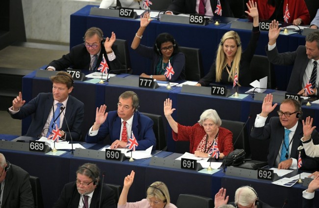 Richard Tice (689), Nigel Farage (690), Anne Widdecombe (691) and others members of UK's Brexit Party vote during a plenary session following a debate on Brexit at the European Parliament in Strasbourg, northeastern France on September 18, 2019. [Photo: AFP]