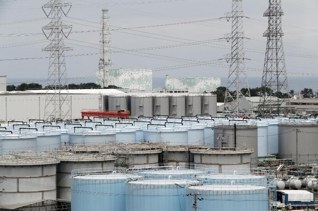 Photo taken on July 27, 2018 and made available on July 30, 2018 shows reactor unit 5 (L) and 6 over storage tanks of radiation contaminated water at the tsunami-crippled Tokyo Electric Power Company (TEPCO) Fukushima Dai-ichi nuclear power plant in Okuma, Fukushima prefecture. [Photo: AFP]