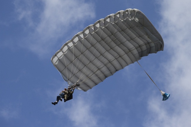 Tom Rice, a 98-year-old American WWII veteran, front left, approaches the landing zone during a tandem parachute jump near Groesbeek, Netherlands, Thursday, Sept. 19, 2019, as part of commemorations marking the 75th anniversary of Operation Market Garden. [Photo: AP/Peter Dejong]