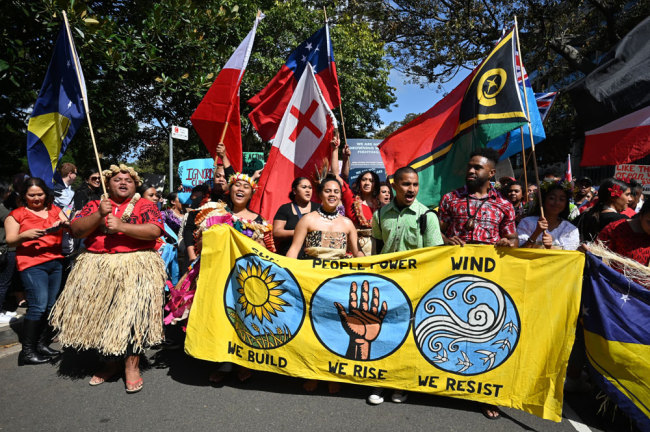 Pacific Islanders attend a protest march as part of the world's largest climate strike in Sydney on September 20, 2019. [Photo: AFP/Peter Parks]