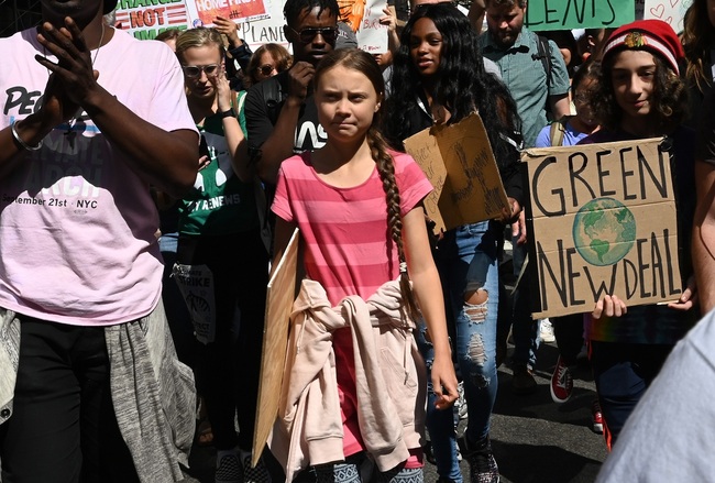 Teen climate activist Greta Thunberg walks with protesters during the Global Climate Strike march in New York September 20, 2019. [Photo: AFP/TIMOTHY A. CLARY]