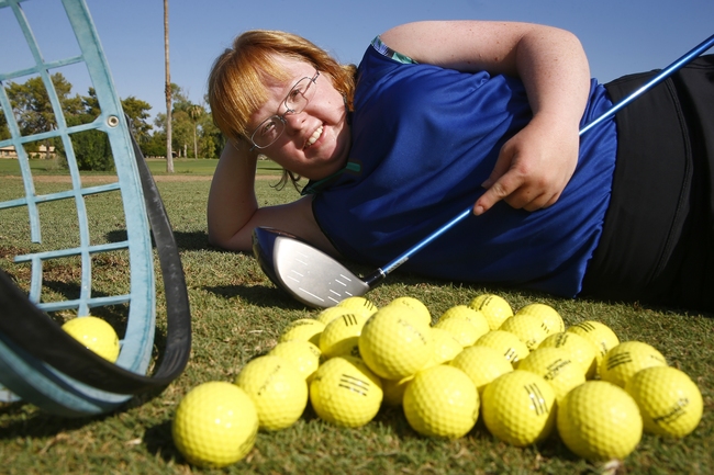 In this Aug. 28, 2019, photo, Amy Bockerstette, the Down syndrome golfer who was an internet sensation by making par at the 16th hole at the Phoenix Open with soon-to-be 2019 U.S. Open champion Gary Woodland, poses for a photograph after practicing with her teaching pro at Palmbrook Country Club in Sun City, Ariz. [Photo: AP/Ross D. Franklin]