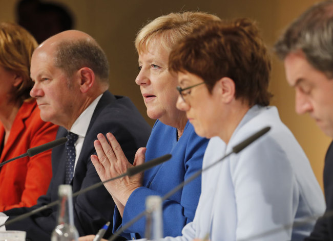 (L to R) German Finance Minister and Vice-Chancellor Olaf Scholz, German Chancellor Angela Merkel, German Defence Minister Annegret Kramp-Karrenbauer and Bavaria's State Premier and leader of the Bavarian Christian Social Union (CSU) Markus Soeder attend a press conference after a climate committee meeting at the Futurium on September 20, 2019 in Berlin. [Photo: AFP/Axel Schmidt]