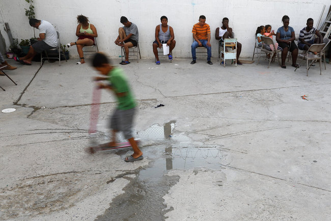 In this July 26, 2019, photo, people from Africa and Central America sit in chairs as the sun sets at El Buen Pastor shelter for migrants in Cuidad Juarez, Mexico. [File photo: AP]