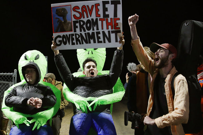 Mario Rayna, center, chants with others at an entrance to the Nevada Test and Training Range near Area 51 Friday, Sept. 20, 2019, near Rachel, Nev. [Photo: AP]