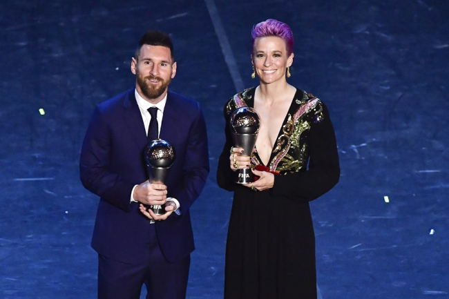 Lionel Messi (Left) and Megan Rapinoe pose for photo at the FIFA Football Awards ceremony in Milan, Italy on Sep 23, 2019. [Photo: IC]