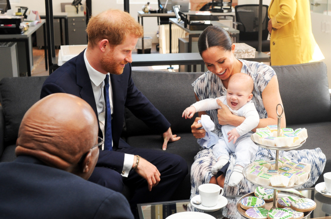 Harry and Meghan, the Duke and Duchess of Sussex and their son Archie meet with Archbishop Desmond Tutu at the Old Granary Building in Cape Town on September 25, 2019. [Photo: DPA via IC/Albert Nieboer]