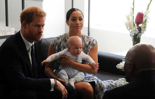 Britain's Prince Harry and Meghan, Duchess of Sussex, holding their son Archie, meet with Anglican Archbishop Emeritus, Desmond Tutu in Cape Town, South Africa, Wednesday Sept. 25, 2019. The royal couple are on the third day of their African tour. [Photo: AP/Henk Kruger/African News Agency]