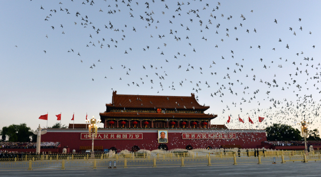 Pigeons are released during the celebrations marking the 70th anniversary of the founding of the People's Republic of China in Beijing on Tuesday, October 1, 2019. [Photo: VCG]