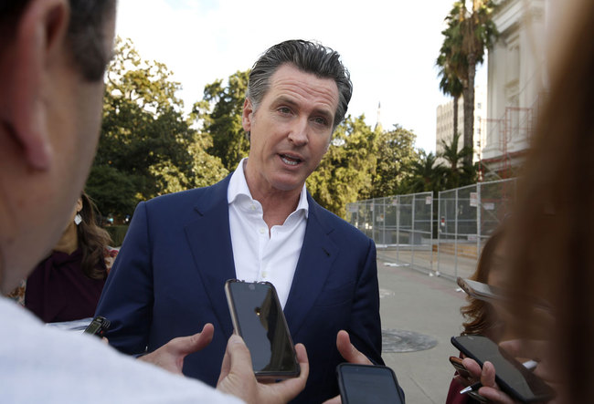 Gavin Newsom talks with reporters at the 52nd Annual Native American Day in Sacramento, Calif., Friday, Sept. 27, 2019. [Photo: AP]