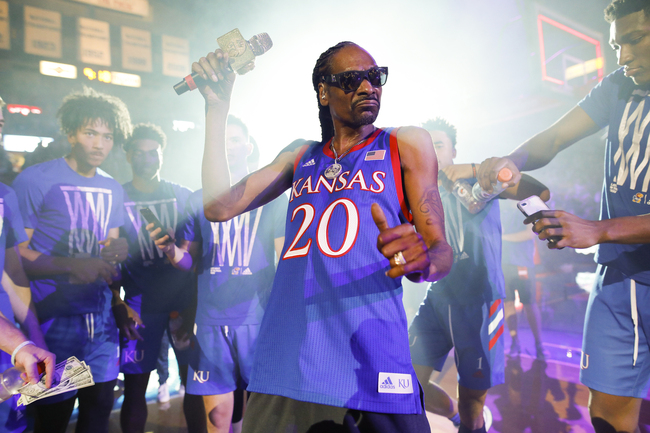 In this Friday, Oct. 4, 2019 photo, rapper Snoop Dogg performs for the Allen Fieldhouse crowd during Late Night in the Phog, Kansas' annual NCAA college basketball kickoff at Allen Fieldhouse in Lawrence, Kan. [Photo: AP]