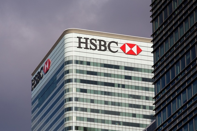 HSBC Sign on office building in Canary Wharf, London. [File Photo: IC]