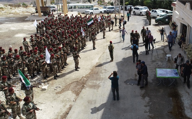 Members of The Syrian National Army take part in the military drill in Afrin district of Syria on October 07, 2019. [Photo: IC/Anadolu Agency/ABACAPRESS.COM]