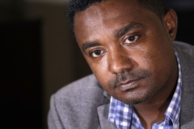 In this photo taken Monday, Sept. 23, 2019, Yonas Yeshanew, who resigned as Ethiopian Airline's chief engineer this summer and is seeking asylum in the U.S., listens to a reporter's question during an interview in Seattle area. [Photo: AP]