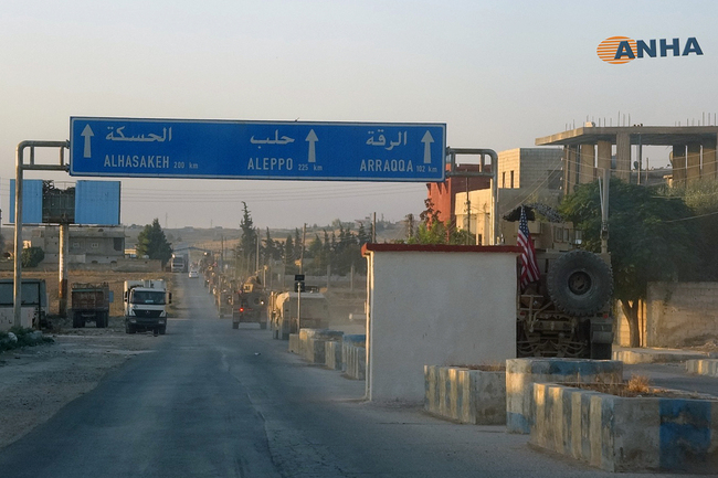 In this image provided by Hawar News Agency, ANHA, a line of U.S. military vehicles travel down a main road in northeast Syria, Monday, Oct. 7, 2019. [Photo: ANHA via AP]