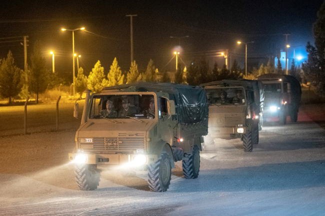 Turkish army soldiers drive towards the border with Syria near Akcakale in Sanliurfa province on October 8, 2019. [Photo: AFP]