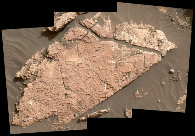 The network of cracks in this Martian rock slab called "Old Soaker" may have formed from the drying of a mud layer more than 3 billion years ago. The view spans about 3 feet (90 centimeters) left-to-right and combines three images taken by the MAHLI camera on the arm of NASA's Curiosity Mars rover. [Photo: nasa.gov/JPL-Caltech/MSSS]