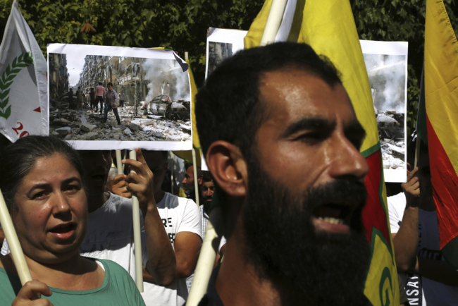 Kurds living in Cyprus shout slogans in front of the U.S. embassy to protest Turkey's offensive into Syria, in Nicosia, Cyprus, Thursday, Oct. 10, 2019. [Photo: AP/Petros Karadjias]