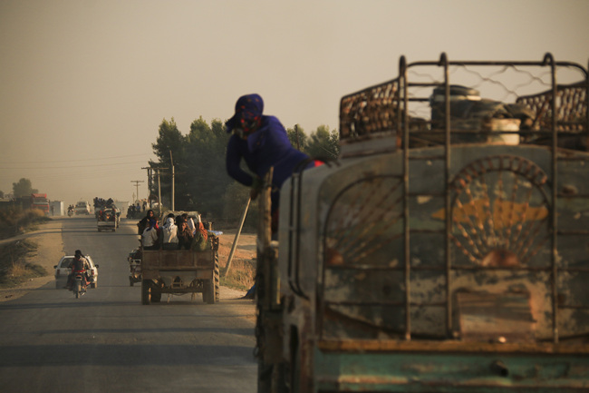 Syrians flee shelling by Turkish forces in Ras al Ayn, northeast Syria, Wednesday, Oct. 9, 2019.  [Photo: AP/Baderkhan Ahmad]