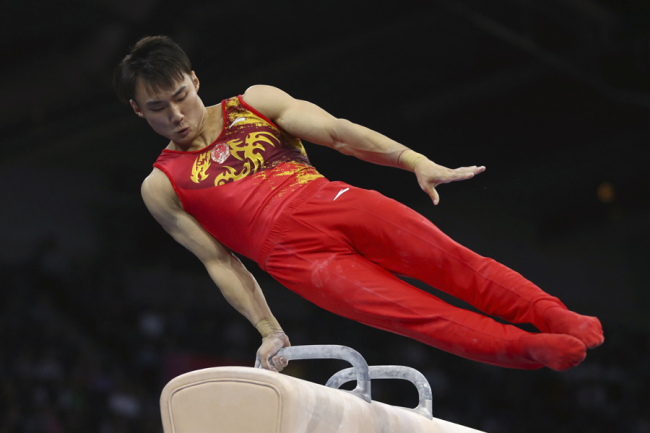 Sun Wei of China performs on the pommel horse in the men's team final at the Gymnastics World Championships in Stuttgart, Germany, Wednesday, Oct. 9, 2019. [Photo: IC]