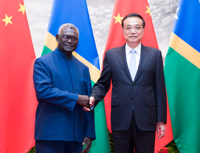 Chinese Premier Li Keqiang meets with Solomon Islands' Prime Minister Manasseh Sogavare at the Great Hall of the People in Beijing on Oct. 9, 2019. [Photo: gov.cn]