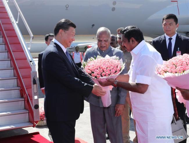 Banwarilal Purohit, governor of the Indian state of Tamil Nadu, and the state's Chief Minister Edappadi K. Palaniswami wait beside the gangway and present flowers to Chinese President Xi Jinping upon his arrival in Chennai, India, Oct. 11, 2019. [Photo: Xinhua/Ju Peng]