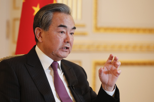 Chinese Foreign Minister Wang Yi gestures during an interview with AFP in Paris on October 21, 2019. [Photo: AFP] 