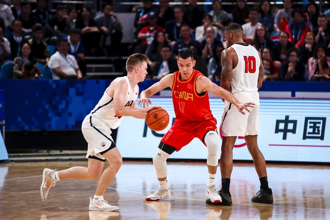 US guard Jacob Van (Left) dribbles the ball during the basketball game against China at the Military World Games in Wuhan on Oct 20, 2019. [Photo: IC]