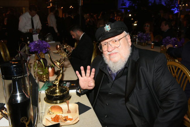 US novelist George R.R. Martin poses with the Emmy for Outstanding Drama Series "Game Of Thrones" during the 70th Emmy Awards Governors Ball at the LA Live Event Deck in Los Angeles on September 22, 2019. [Photo: AFP]