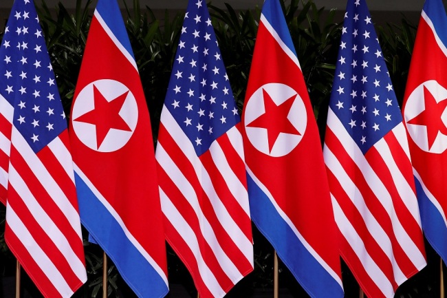 U.S. and North Korean national flags are seen during the meeting of U.S. President Donald Trump and North Korean leader Kim Jong Un at the Capella Hotel on Sentosa island in Singapore June 12, 2018. [File Photo: VCG]