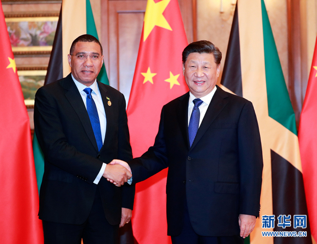 Chinese President Xi Jinping meets with Jamaican Prime Minister Andrew Holness in Shanghai, Nov. 4, 2019. [Photo: Xinhua]