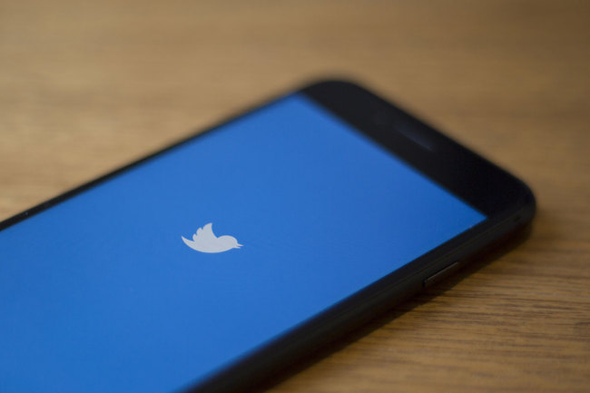 In this file photo taken on July 10, 2019 the Twitter logo is seen on a phone in in Washington, DC. [Photo: AFP]
